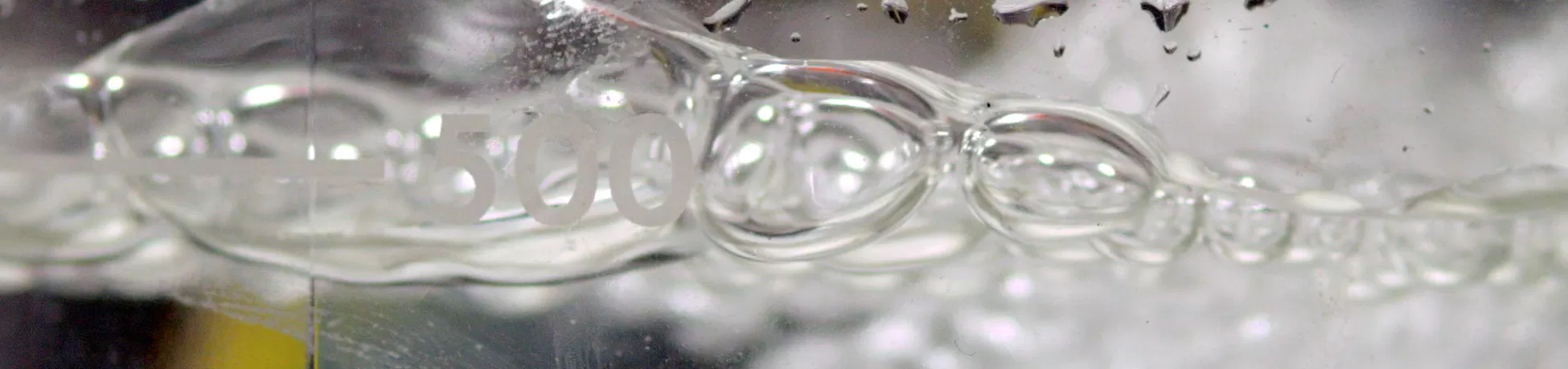Liquid bubbling in a container with volume indicators