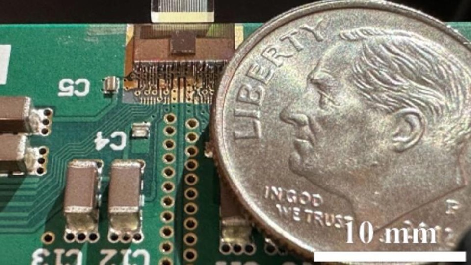 An ultra-compact photonic data transmission system with a dime for scale
