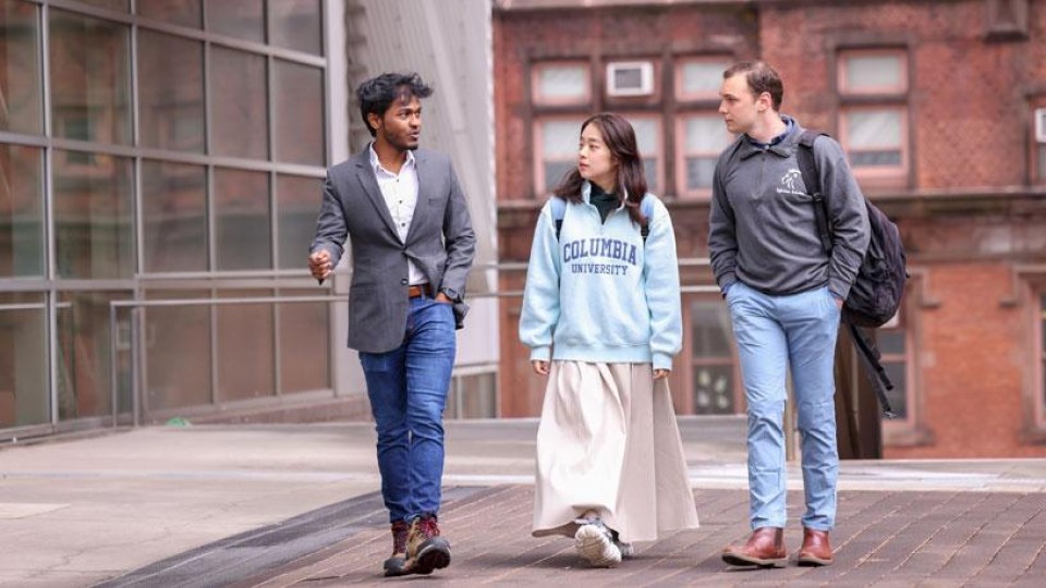 3 students walking