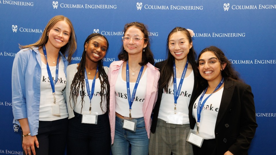 Five women posing for a photo in front of a Columbia Engineering-themed backdrop.