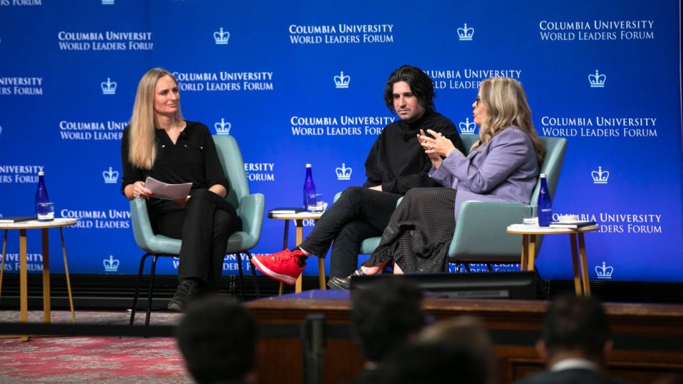 Lydia Chilton moderating a panel discussion with Anastasis Germanidis and Jennifer Lee, who is speaking to the moderator, at the Columbia University World Leaders Forum.