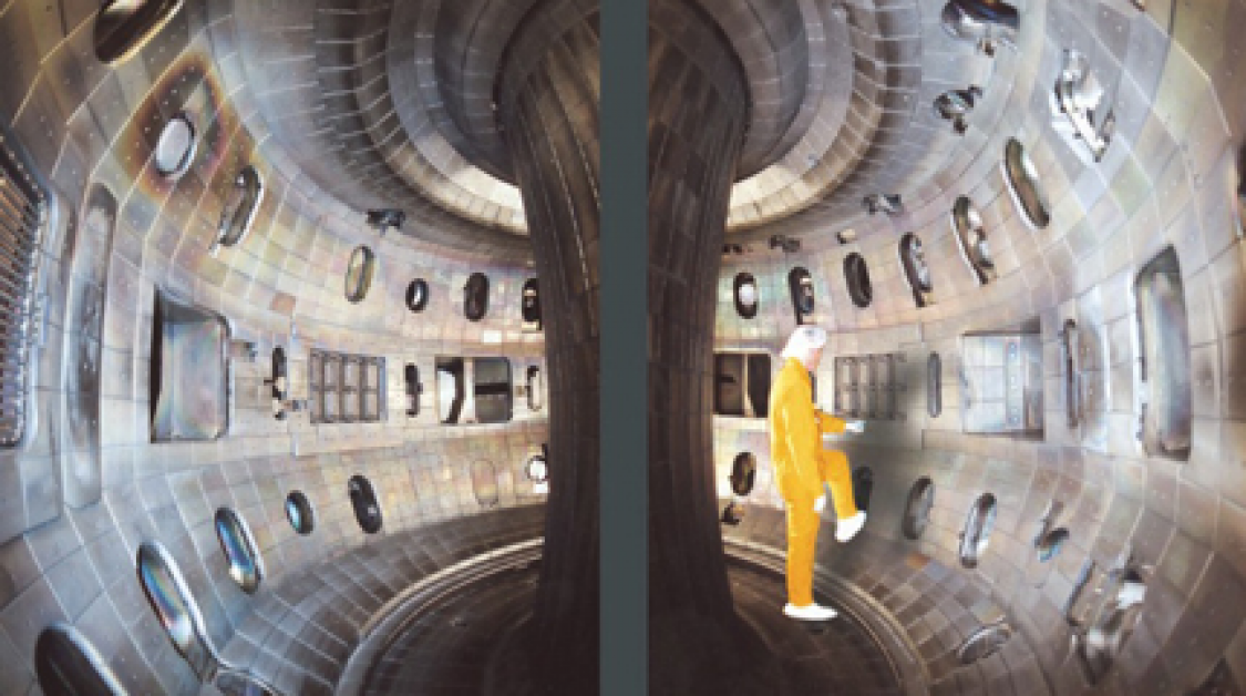 A man standing in a large metal construct