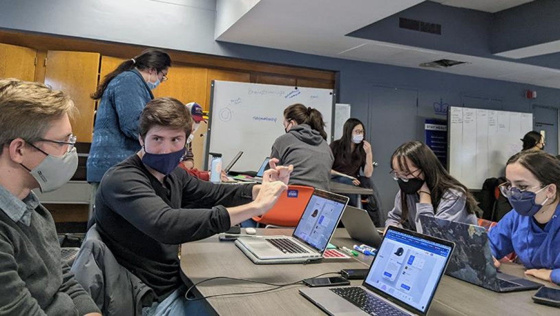 Students in the Designing for Humanity class working collaboratively to solve problems