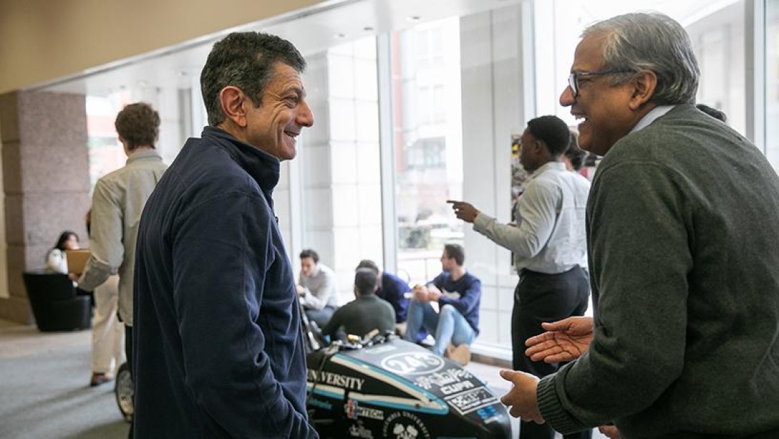 Vijay Modi and Daniel Bienstock conversing
