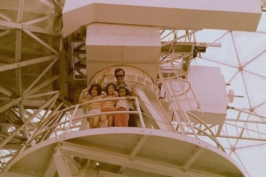 Michal Lipson as a child (far left) with her twin sister, a friend, and her father taken on the radio telescope of Atibaia, Brazil.