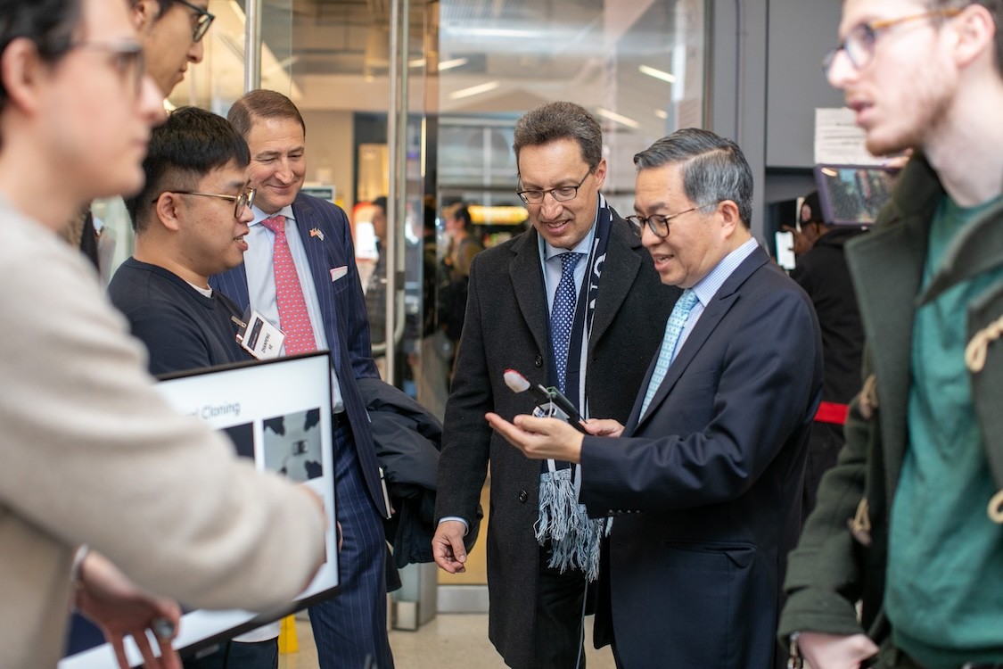 Dean Shih-Fu Chang (foreground) with University trustee members, Keith Goggin (center) and Victor Mendelson.