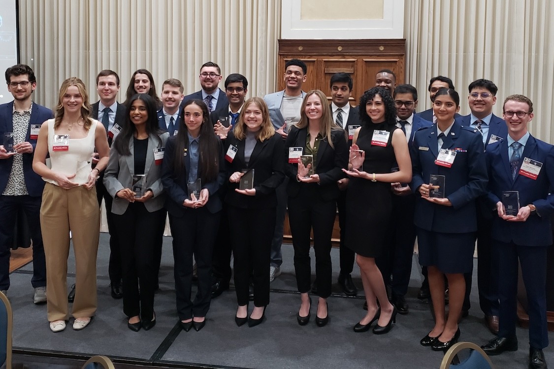 The Twenty Aviation Week Network’s 20 Twenties Class of 2025 holding their awards