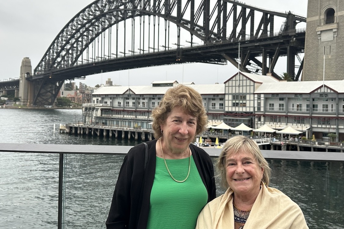Kathy McKeown and Cécile Paris posing for a photo in front of a bridge