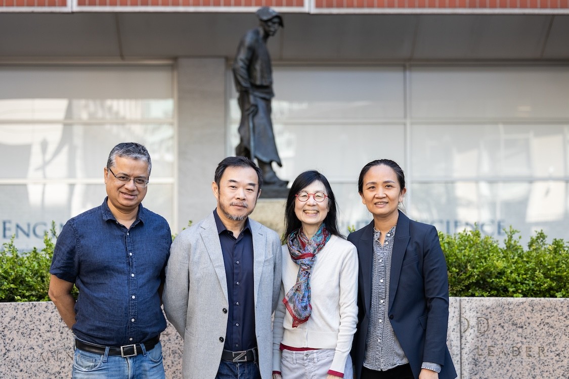 Vishal Misra, Eric Xing, Jeannette Wing, and Tian Zeng smiling for a photo