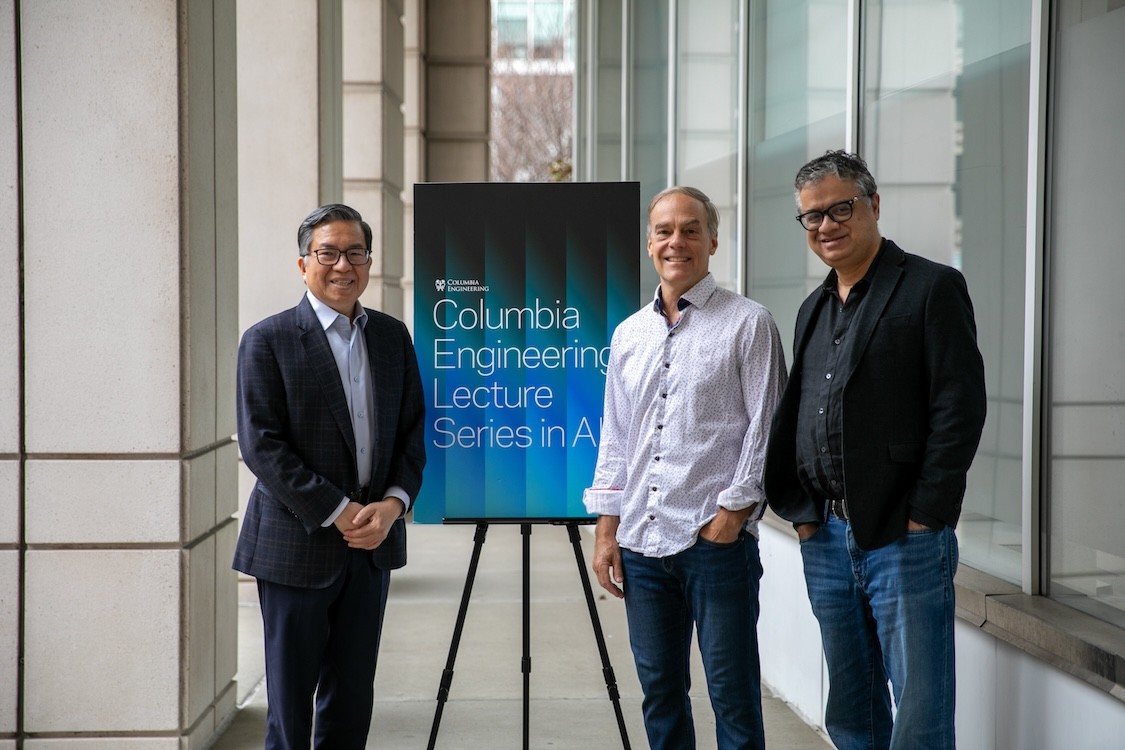 Shih-Fu Chang, Richard Zemel, and Vishal Misra posing for a photo next to a poster that reads "Columbia Engineering Lecture Series in AI"