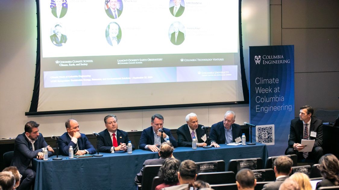 Six panelists seated at a table as the moderator, Brian Hanrahan, looks toward them during a Lenfest Center for Sustainable Energy panel at Columbia University.