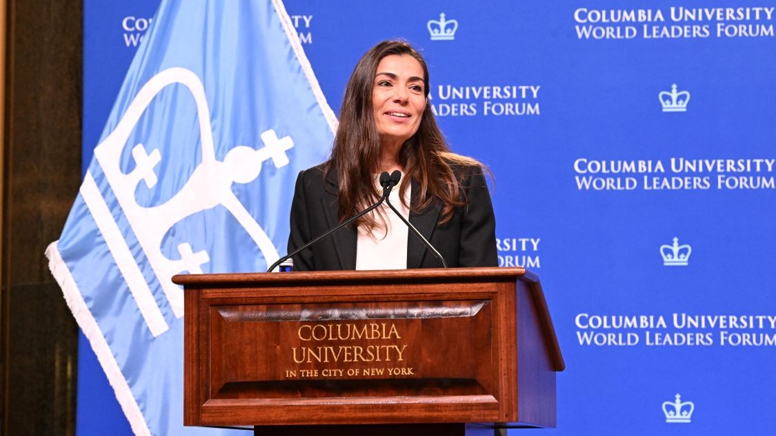 Costantza Sbokou Constantakopoulou speaking behind a Columbia University-branded podium at the Columbia University World Leaders Forum.