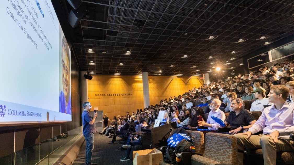 A speaker addresses a packed auditorium of students during a Columbia Engineering orientation.