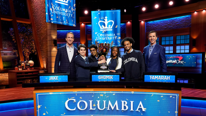 Columbia Bowl Champions standing with the trophy