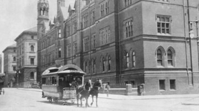 Horse carriages in front of a building