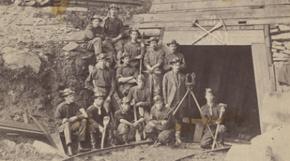 A group of miners outside a mine
