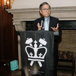 Dean Shi-Fu Chang at a podium
