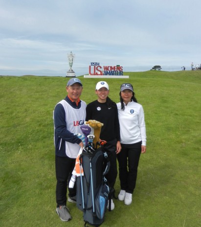 Edward Paik and family in front of a USGA Women’s sign