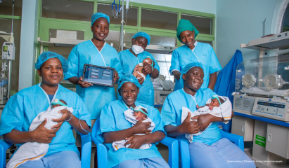 doctors holding new born infants