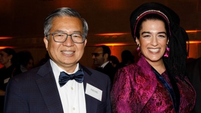 Dean Shih-Fu Chang and Natalie Fardian-Melamed smile while posing together at the awards ceremony.